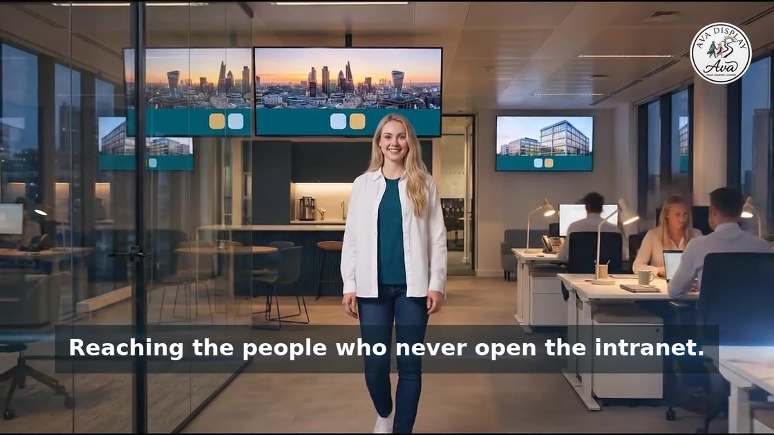 Ava on an office floor as light runs from her to each screen